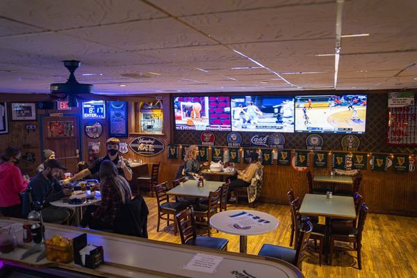 The dining room, screens on for the game