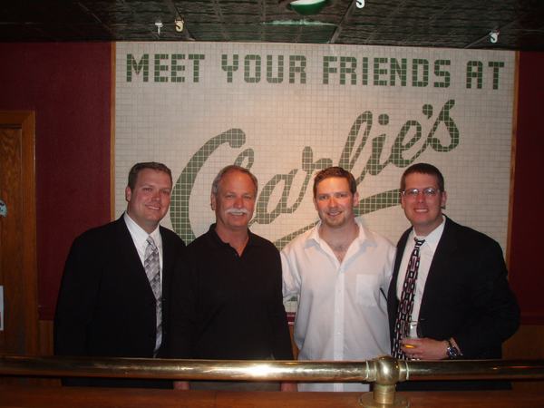 Four generations' worth — under the “Meet Your Friends at Charlie's” mural